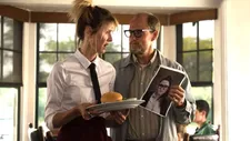 Pippi with Wilson holding photo of their daughter Claire (Isabella Amara)